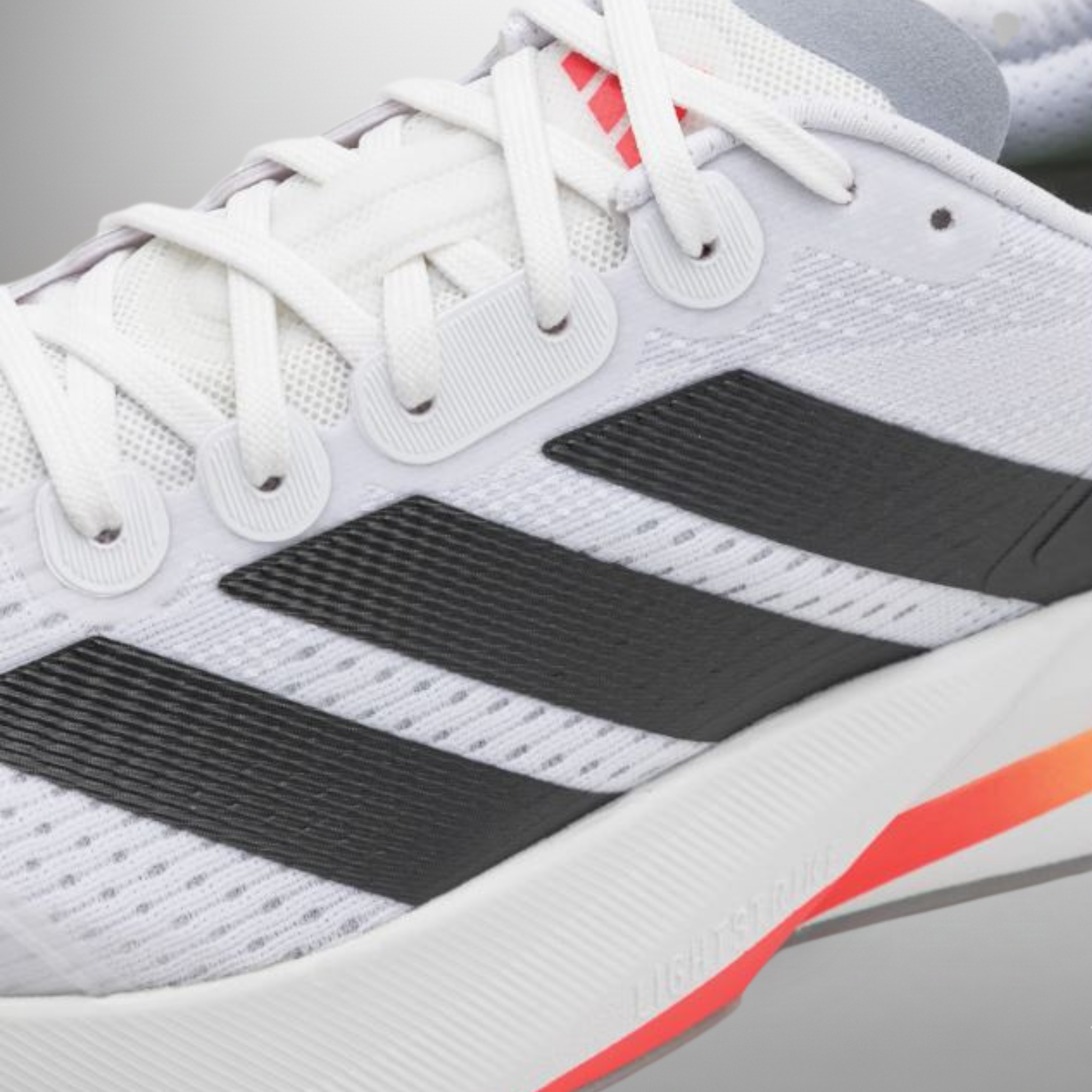 Zapatillas Adidas Duramo Speed 2 blanco detalle del logo y materiales