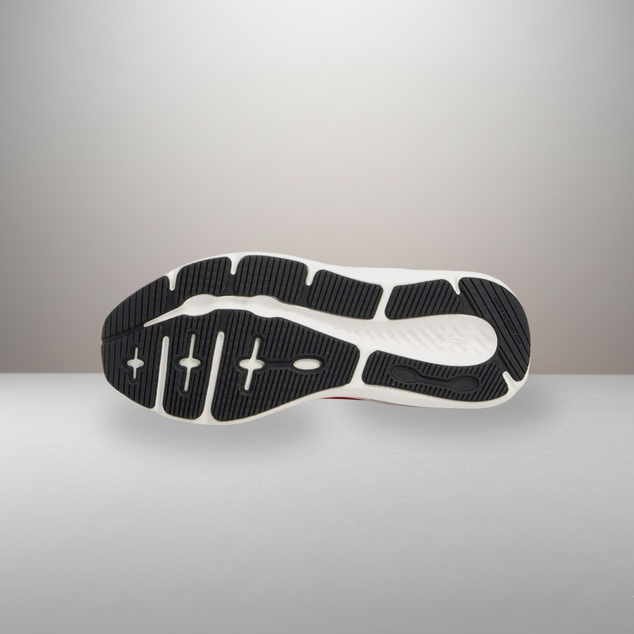 Zapatillas Under Armour Charged Pursuit 3 rojo talla 41 detalle de la suela con patrón de tracción para flexibilidad